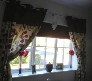 A Lovely Maroon Roman Blind to Complement The Curtains